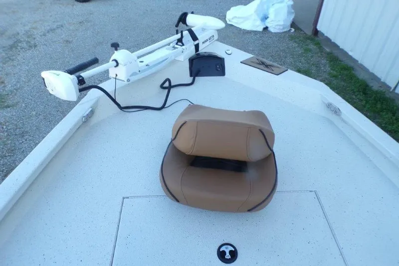 Slide: The Image of 2026 Xpress H20B Bay boat deck with tan seat and trolling motor. - 17