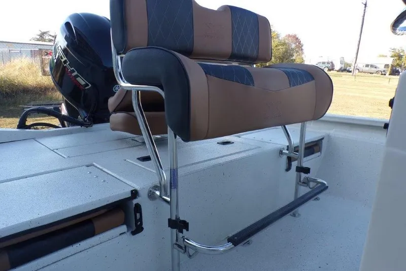 Slide: The Image of 2026 Xpress H20B Bay boat interior with cushioned seating and Yamaha outboard motor. - 23