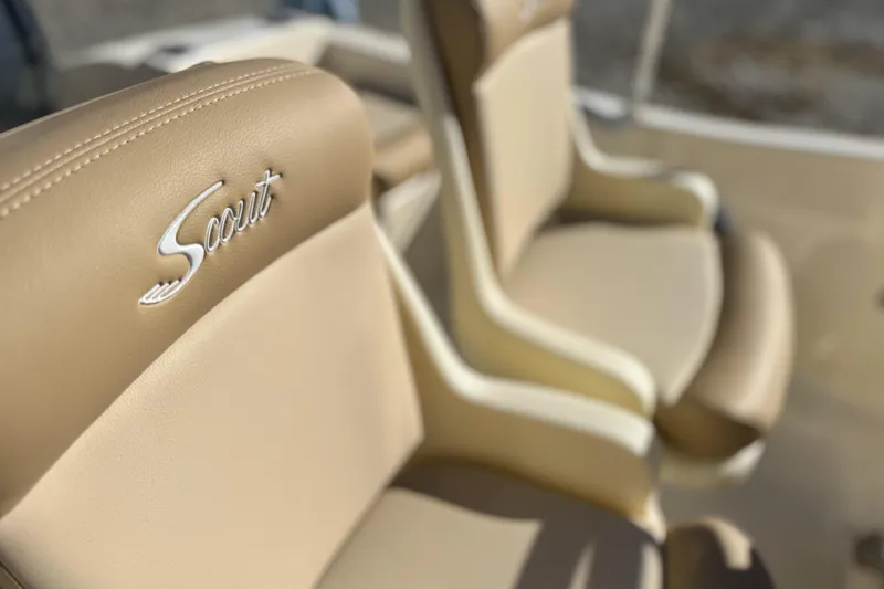 Slide: The Image of Beige leather seats in 2026 Scout 175 Sportfish boat interior. - 13