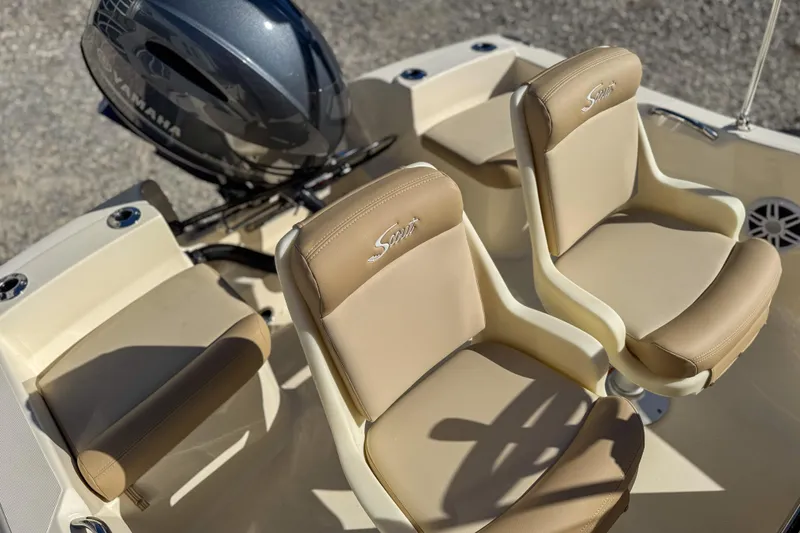 Slide: The Image of 2026 Scout 175 Sportfish boat interior with Yamaha engine and beige seating. - 15
