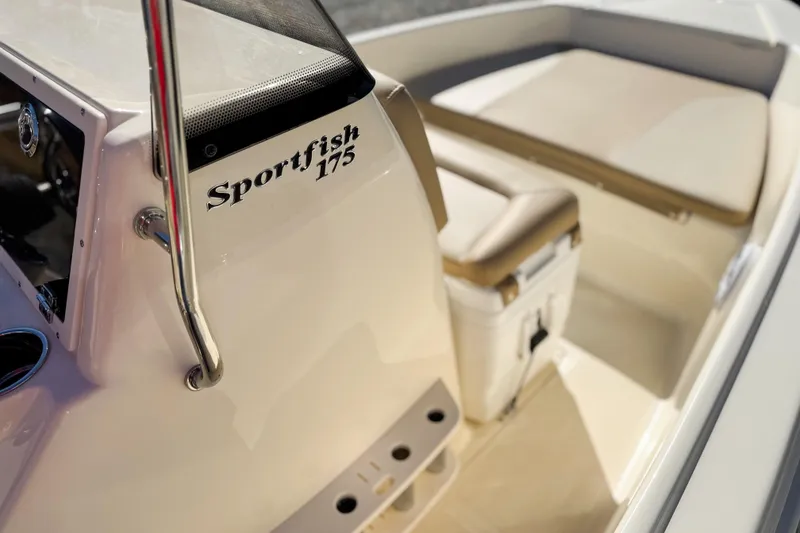 Slide: The Image of 2026 Scout 175 Sportfish boat interior with seating and console details. - 17