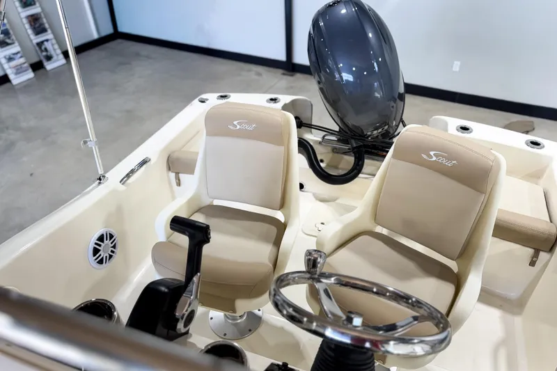 Slide: The Image of 2026 Scout 175 Sportfish boat interior with steering wheel and seating. - 26