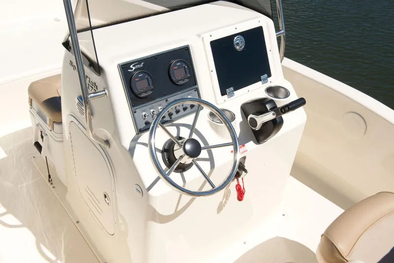 Slide: The Image of Manufacturer Provided Image: 2025 Scout 175 Sportfish boat console with steering wheel and controls. - 4