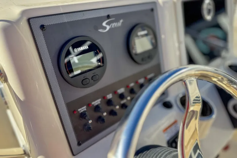 Slide: The Image of 2026 Scout 175 Sportfish dashboard with Yamaha tachometer and steering wheel. - 9