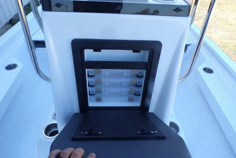 Slide: The Image of 2026 Xpress H20B Bay boat console with storage compartments and cup holders. - 10