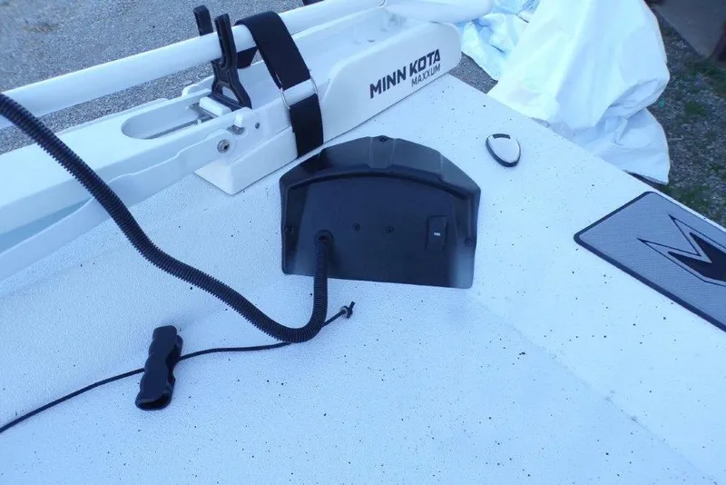 Slide: The Image of 2026 Xpress H20B Bay boat deck with Minn Kota Maxxum trolling motor. - 11