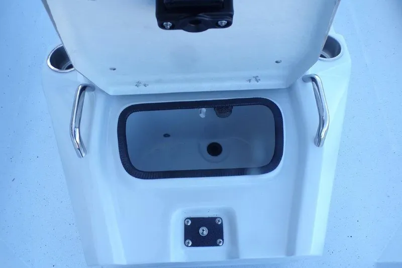Slide: The Image of Open storage compartment on 2026 Xpress H20B Bay boat with stainless steel handles. - 12