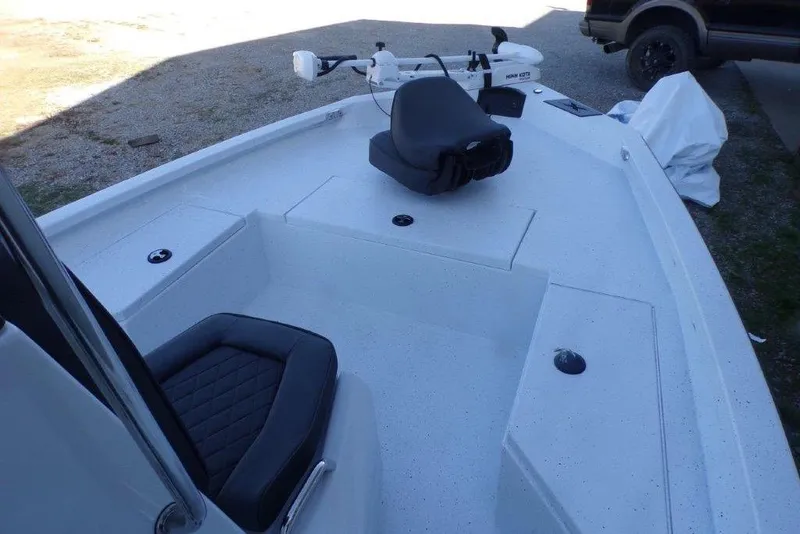 Slide: The Image of 2026 Xpress H20B Bay boat interior with seating and storage compartments. - 14