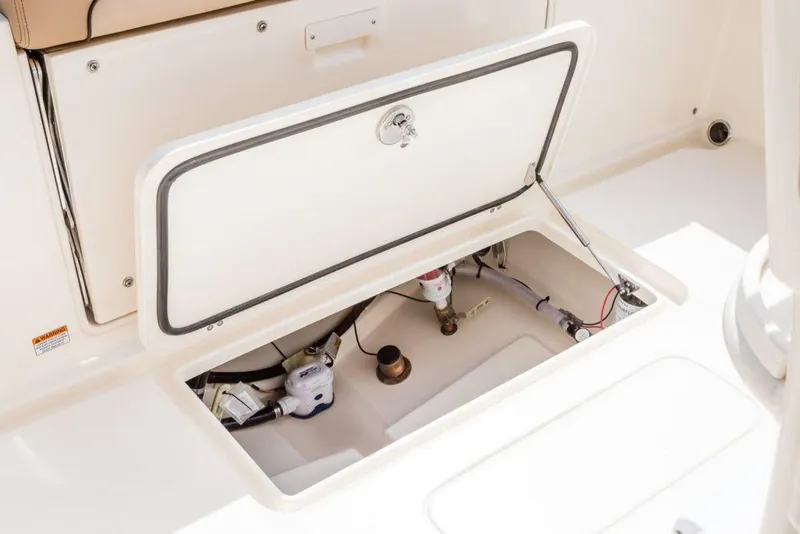 Slide: The Image of Interior view of 2026 Scout 240 XSF boat, featuring spacious seating and storage compartments. - 17