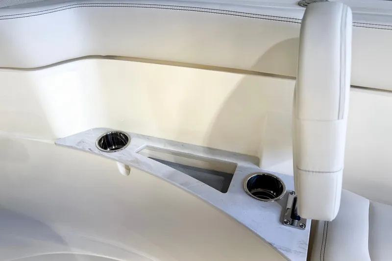 Slide: The Image of Interior of 2026 Scout 240 XSF boat with cup holders and seating. - 20