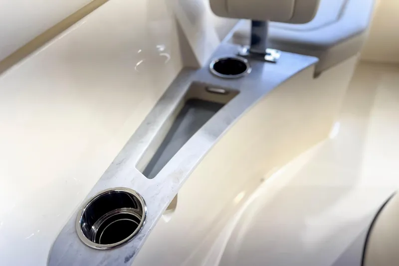 Slide: The Image of 2026 Scout 240 XSF boat interior with stainless steel cup holders. - 23