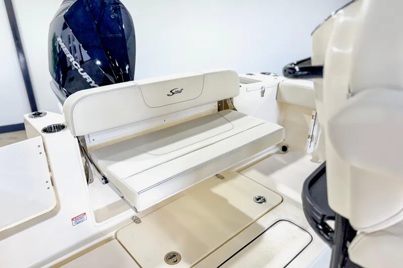 Slide: The Image of 2026 Scout 240 XSF boat interior with foldable seating and Mercury engine. - 25