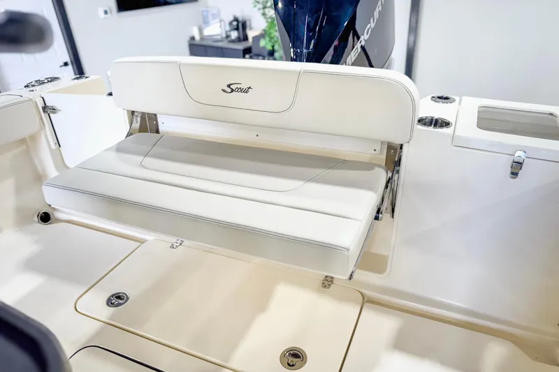 Slide: The Image of 2026 Scout 240 XSF boat interior with foldable seating and storage compartments. - 26