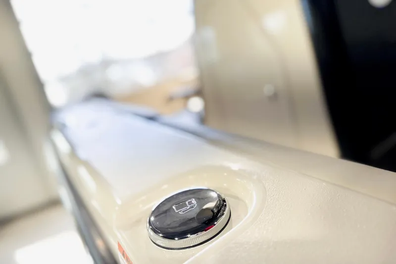 Slide: The Image of Close-up of 2026 Scout 240 XSF boat detail with chrome button. - 27