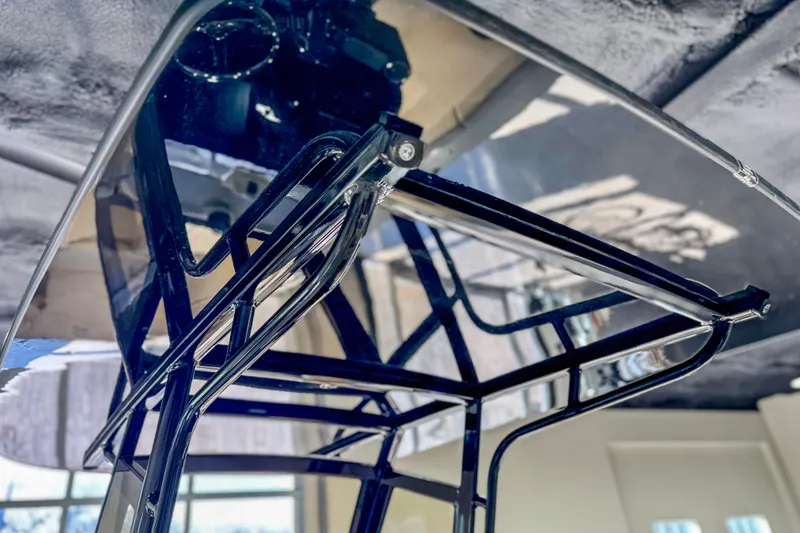 Slide: The Image of 2026 Scout 240 XSF boat T-top frame, sleek design, polished metal finish. - 31