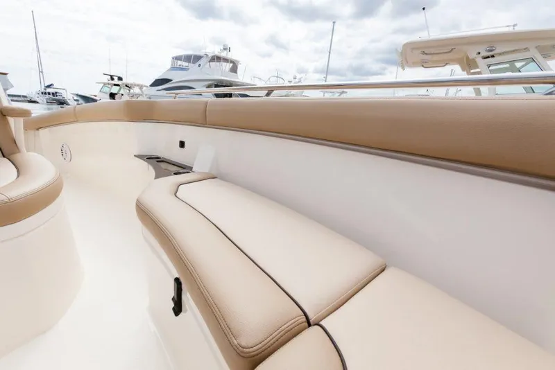 Slide: The Image of 2026 Scout 240 XSF boat helm with modern controls and steering wheel. - 6