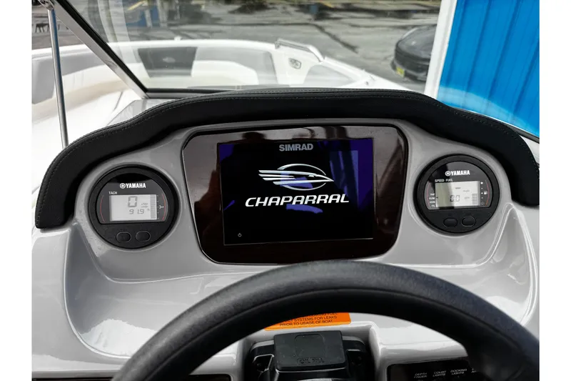 Slide: The Image of 2023 Chaparral 21 SSi OB dashboard with Simrad display and Yamaha gauges. - 20