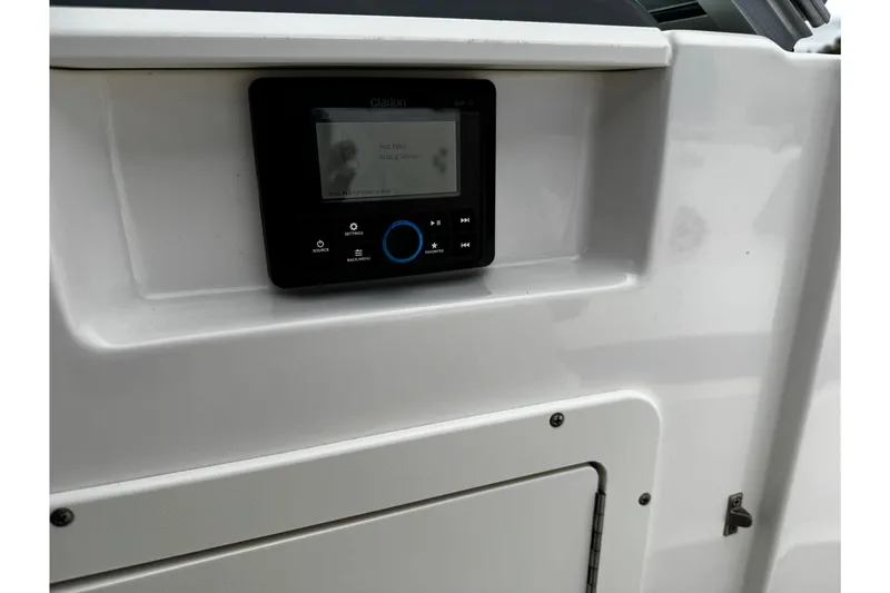 Slide: The Image of 2023 Chaparral 21 SSi OB boat dashboard with Clarion audio system. - 24