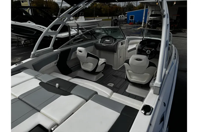 Slide: The Image of 2023 Chaparral 21 SSi OB boat interior with modern seating and dashboard. - 26