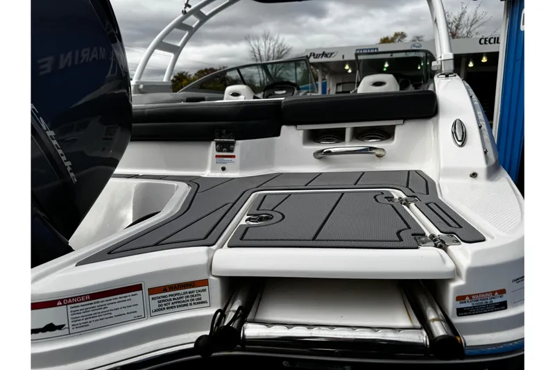 Slide: The Image of 2023 Chaparral 21 SSi OB boat with sleek deck design and modern features. - 28