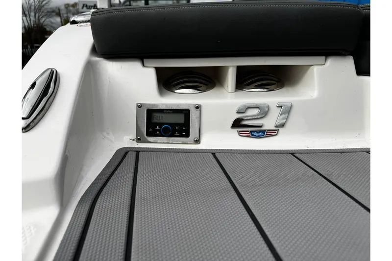 Slide: The Image of 2023 Chaparral 21 SSi OB boat deck with audio system and model emblem. - 29