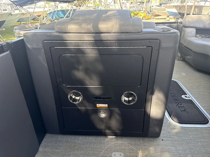 Slide: The Image of Sanpan 2500 MTF 2026 boat interior with storage compartment and cup holders. - 11