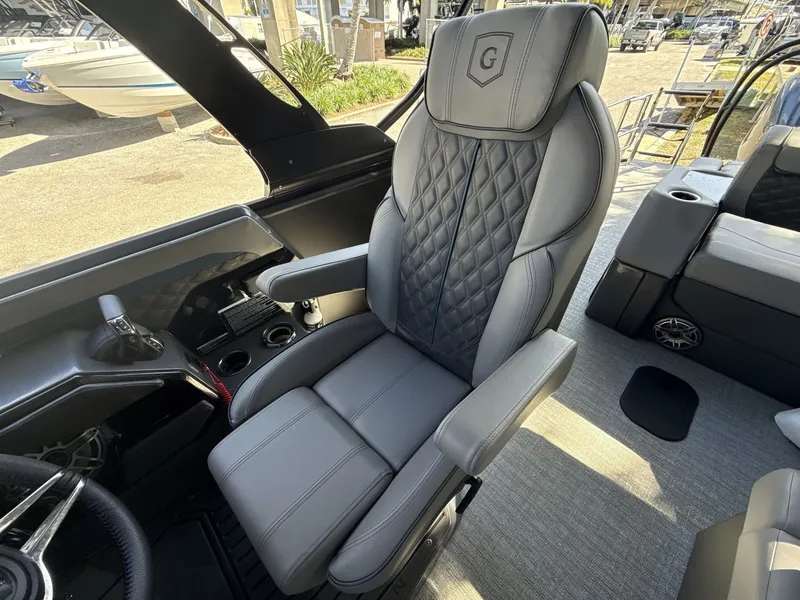 Slide: The Image of Captain's chair in 2026 Sanpan 2500 MTF boat, featuring luxurious gray upholstery. - 12