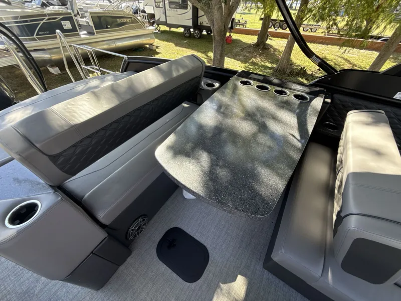 Slide: The Image of Interior of 2026 Sanpan 2500 MTF pontoon boat with seating and table. - 14