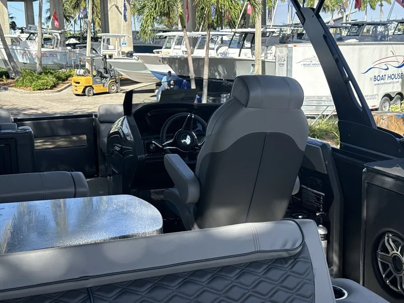 Slide: The Image of Interior of a 2026 Sanpan 2500 MTF boat with luxurious seating and steering console. - 20