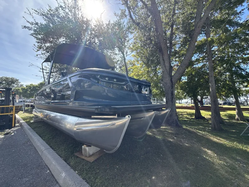 Slide: The Image of Sanpan 2500 MTF pontoon boat, 2026 model, parked under trees in sunlight. - 6