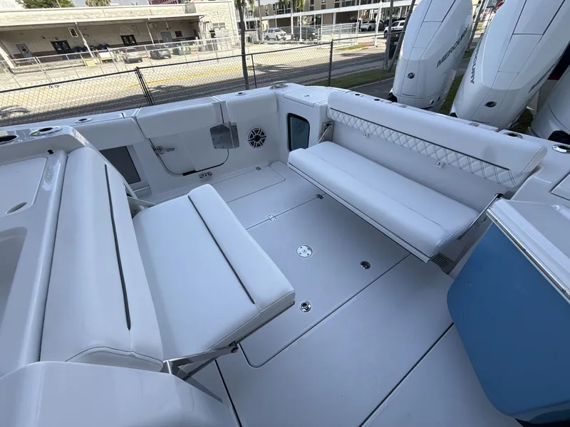 Slide: The Image of 2026 Sportsman Open 352 Center Console boat interior with white seating and spacious deck. - 14