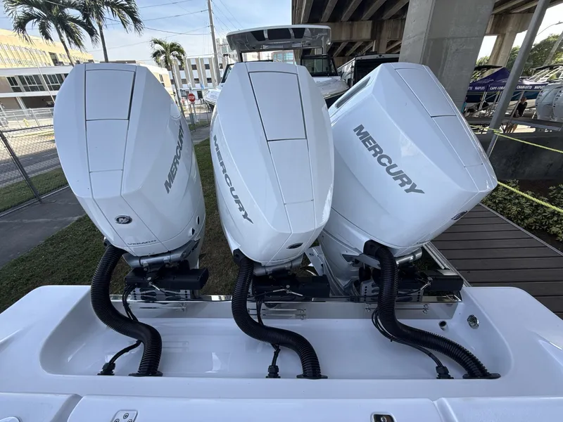 Slide: The Image of 2026 Sportsman Open 352 Center Console with triple Mercury outboard engines. - 19