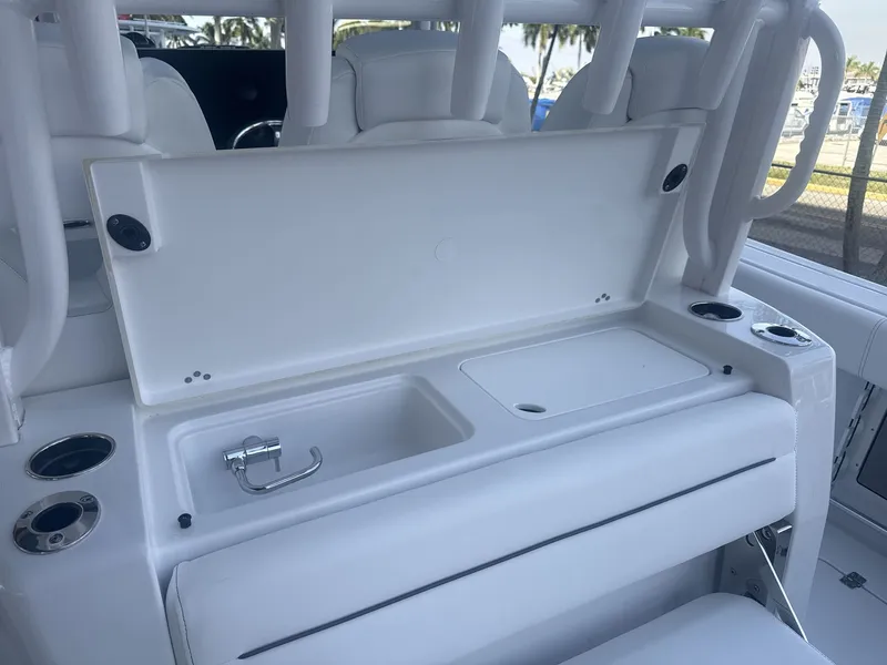Slide: The Image of 2026 Sportsman Open 352 Center Console boat interior with seating and storage compartments. - 23