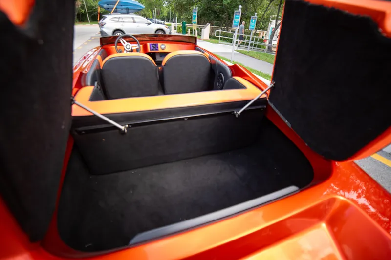 Slide: The Image of 1984 Sleekcraft Aristocrat 20 boat interior with open storage compartment. - 29