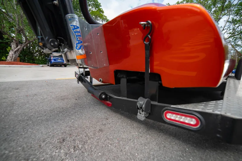 Slide: The Image of 1984 Sleekcraft Aristocrat 20 boat on trailer, close-up of orange hull and hitch. - 6