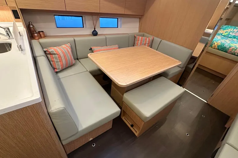 Slide: The Image of Luxurious interior of 2022 Bavaria C45 yacht with modern dining and navigation area. - 23