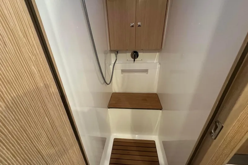 Slide: The Image of Modern bathroom interior of 2022 Bavaria C45 yacht with wood accents and sleek fixtures. - 39