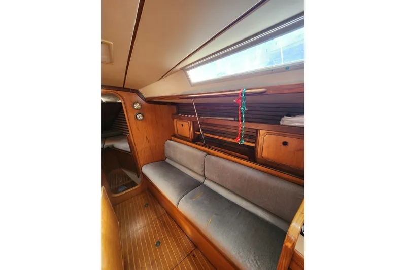 Slide: The Image of Interior of 1988 Beneteau First 405 sailboat with wooden cabinetry and seating. - 21