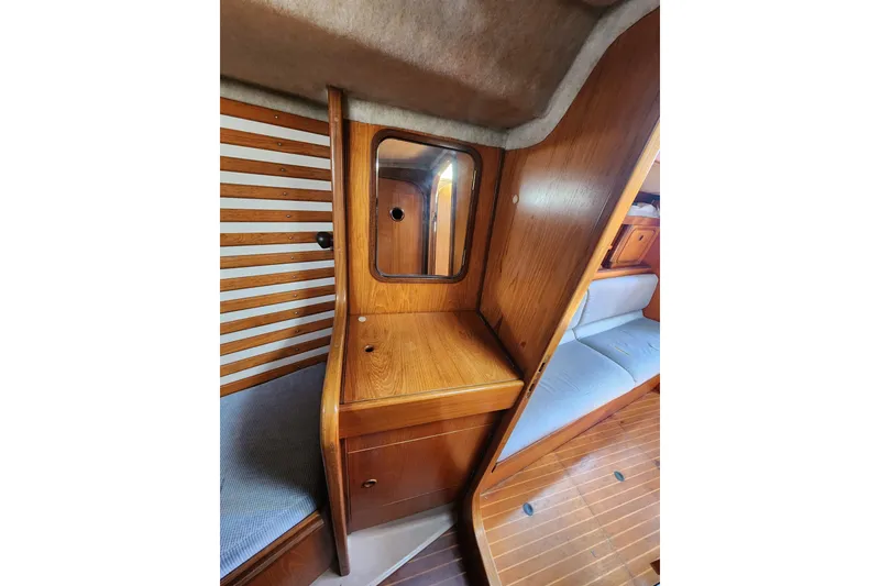 Slide: The Image of Interior of 1988 Beneteau First 405 yacht with wooden cabinetry and seating. - 35