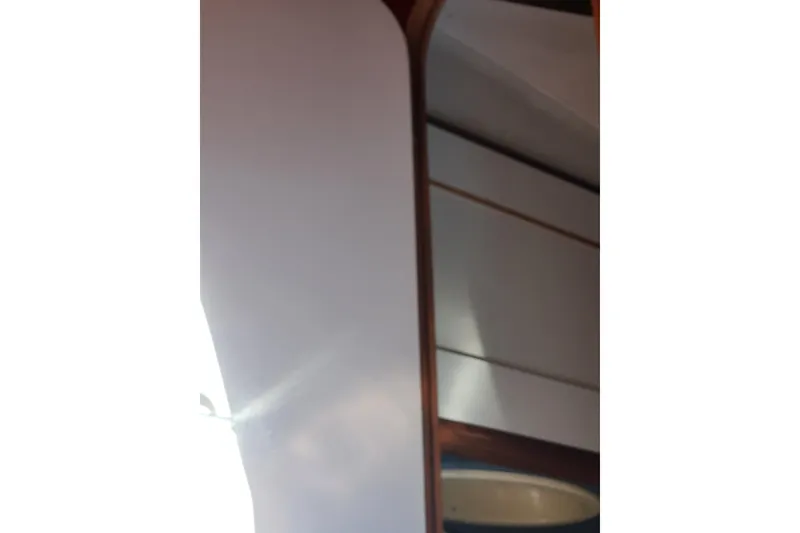 Slide: The Image of Interior view of 1988 Beneteau First 405 yacht, featuring wooden paneling and sleek design. - 41
