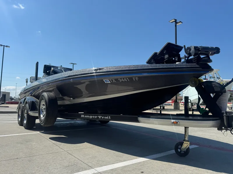 Slide: The Image of 2019 Ranger Z520L boat on trailer in parking lot under clear blue sky. - 10