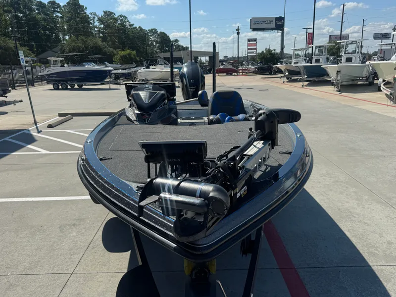 Slide: The Image of 2019 Ranger Z520L boat in a dealership lot, featuring advanced fishing equipment. - 12