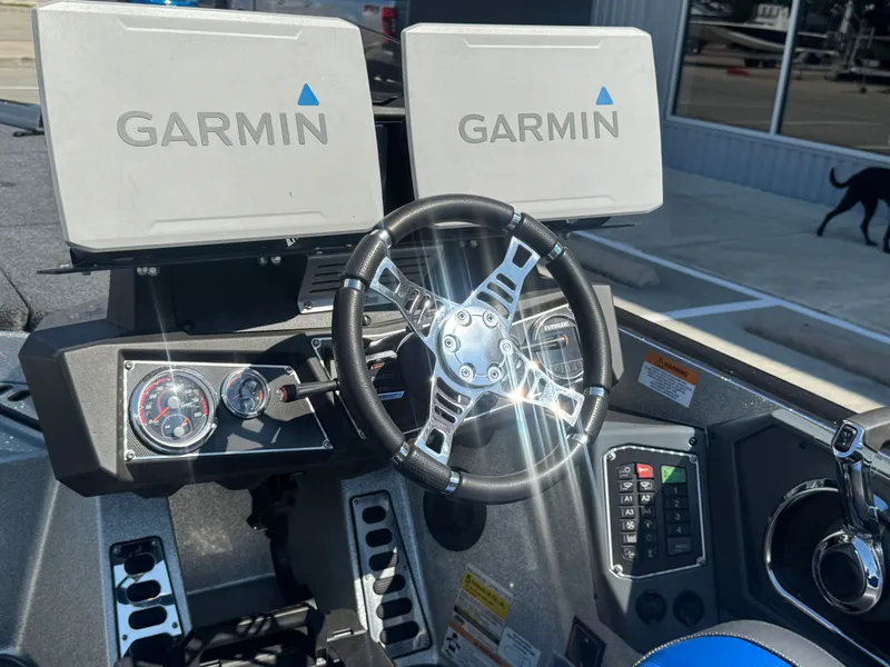 Slide: The Image of 2019 Ranger Z520L boat dashboard with Garmin displays and steering wheel. - 20
