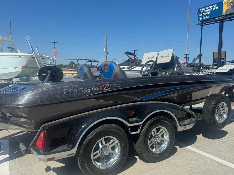 Slide: The Image of 2019 Ranger Z520L boat with dual Garmin displays on a trailer in a parking lot. - 5
