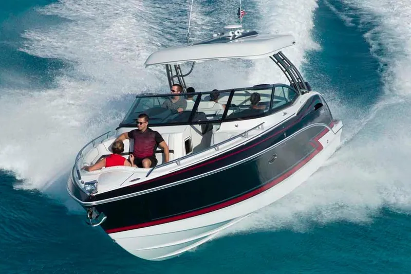 Slide: The Image of 2018 Formula 350 Crossover Bowrider on stands, side view, outdoors. - 1