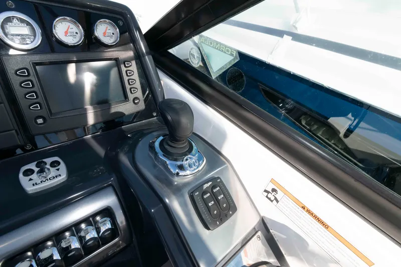 Slide: The Image of 2018 Formula 350 Crossover Bowrider dashboard with controls and gauges. - 10