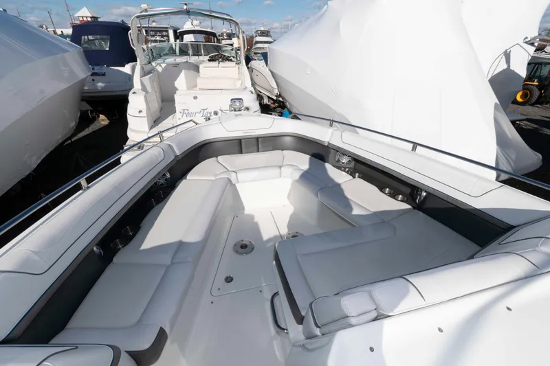 Slide: The Image of 2018 Formula 350 Crossover Bowrider with spacious seating in marina setting. - 13
