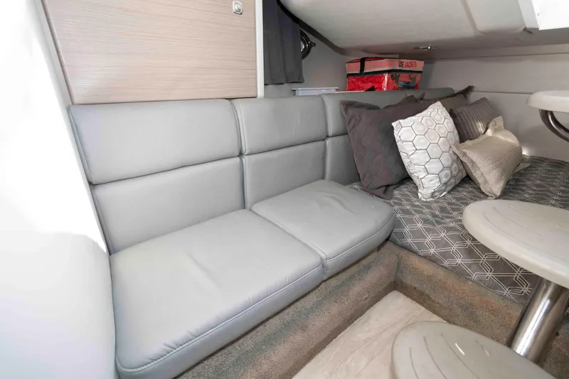 Slide: The Image of 2018 Formula 350 Crossover Bowrider interior with gray seating and decorative pillows. - 17