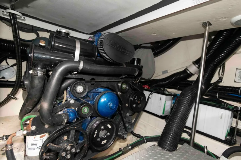 Slide: The Image of Engine compartment of a 2018 Formula 350 Crossover Bowrider, showcasing dual engines. - 23