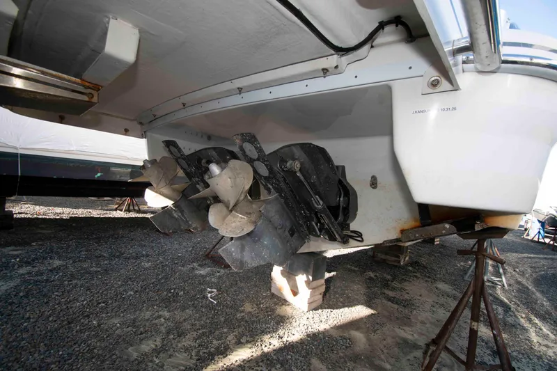 Slide: The Image of 2018 Formula 350 Crossover Bowrider boat underside with dual propellers on dry dock. - 29